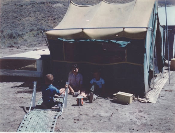 My brothers and I at camp - we found a patch of shade. I never could figure out how to work that lounge chair.